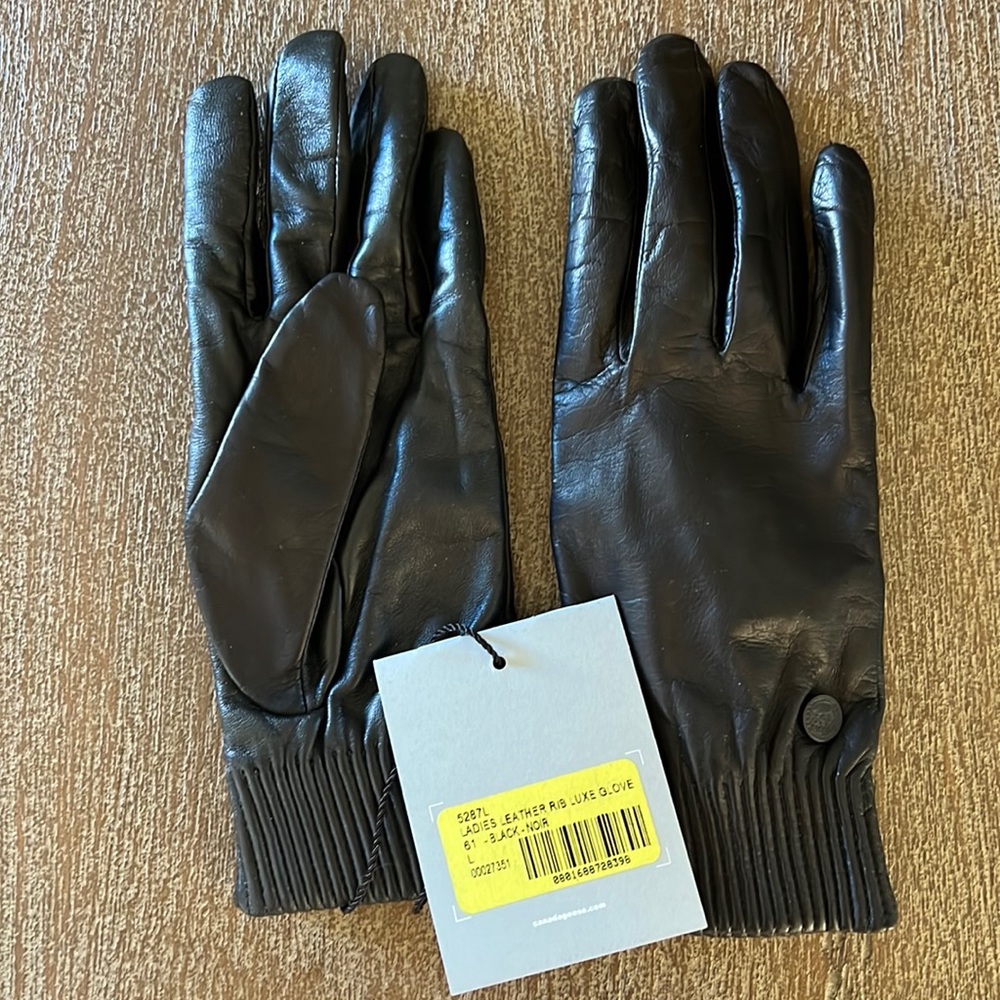 Canada goose black leather gloves. Never worn. Runs small